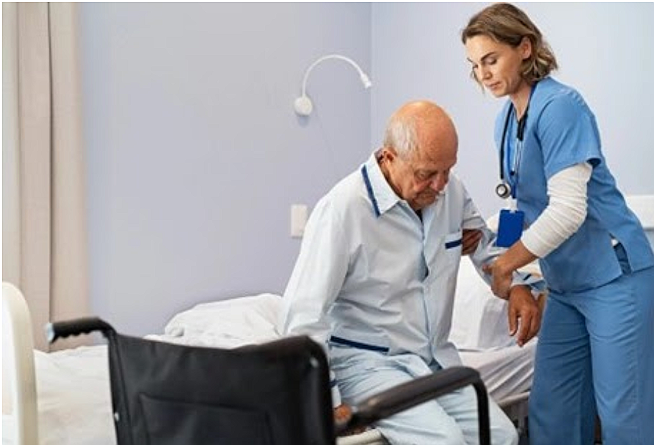 Nurse assisting a patient at the bedside
